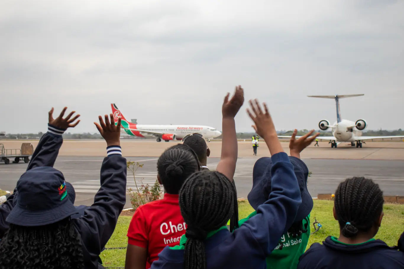 Cherry Hills pupils wave towards aircraft during their educational tour at Kenneth Kaunda International Airport